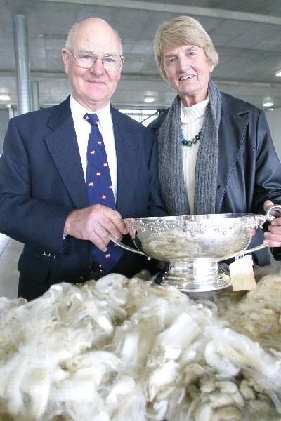 Trail-blazing Corriedale breeders Jim and Brenda Venters with the J.F. Guthrie trophy for the most valuable skirted Corriedale ram fleece in the 2010 Royal Melbourne Show Fleece Competition. Source: Stock Journal