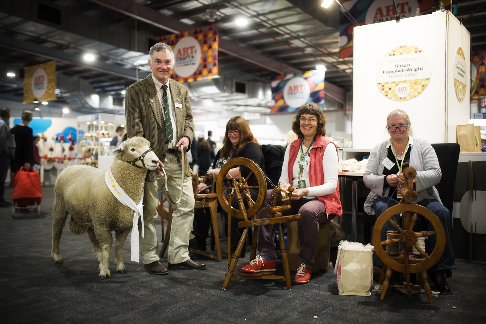 Dr Roger Wilkinson with his well-behaved Romney ram in the Arts, Crafts and Cookery Pavilion at the 2016 Melbourne Royal Show.